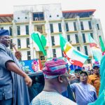 APC supporters welcome Yilwatda at party secretariat. Credit