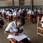 students writing exams in the hall
