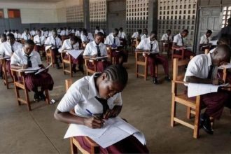 students writing exams in the hall