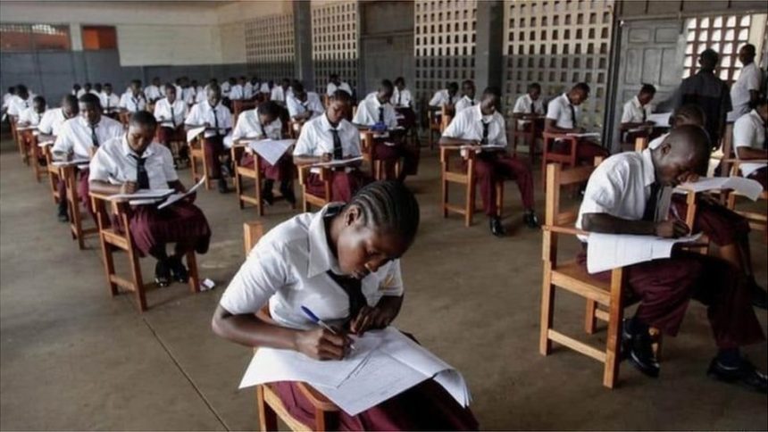students writing exams in the hall