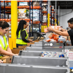 Volunteers assemble relief packages for Hurricane Melissa at the Global Empowerment Mission headquarters in Miami, Florida, on October 27, 2024.