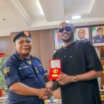 2Baba with the Controller General of the Federal Fire Service, Samuel Adeyemi.