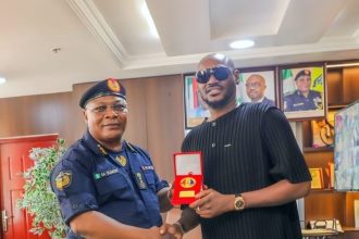 2Baba with the Controller General of the Federal Fire Service, Samuel Adeyemi.